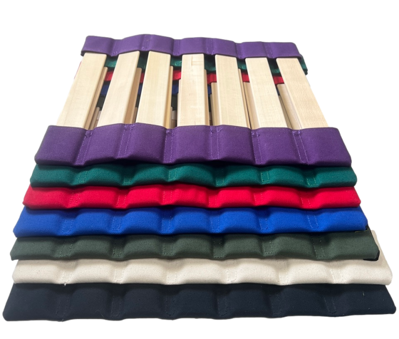 Colorful stack of HalfHOWDA seats. Purple, Red, Black, Natural, Army Green, Forest Green, Cobalt, Red