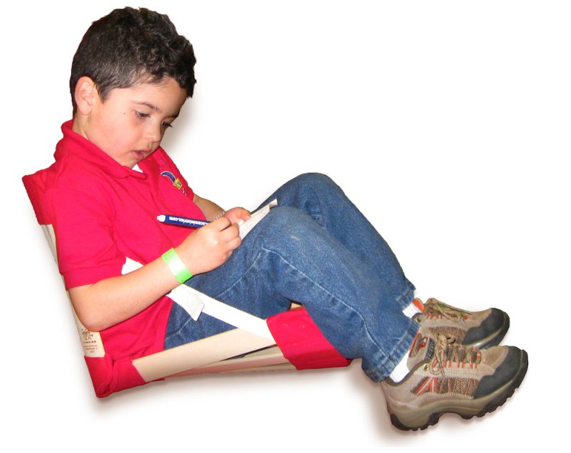 Boy in red shirt sitting in HowdaHUG seat